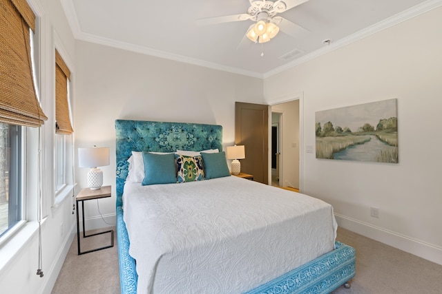 bedroom with ceiling fan, baseboards, carpet floors, and ornamental molding
