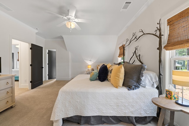 bedroom featuring light colored carpet, a ceiling fan, ornamental molding, and visible vents