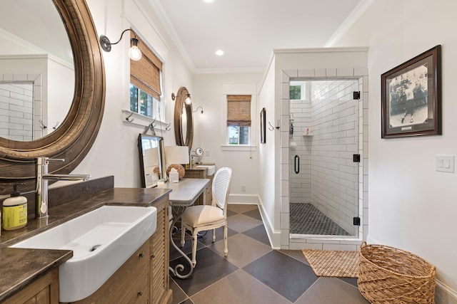 full bath with tile patterned floors, baseboards, a shower stall, crown molding, and vanity