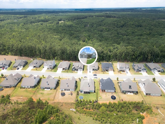 bird's eye view featuring a residential view and a view of trees