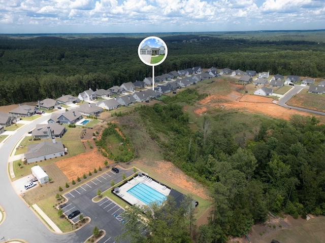 aerial view featuring a view of trees