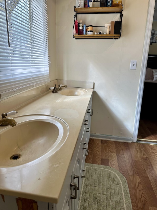 bathroom featuring vanity and hardwood / wood-style floors