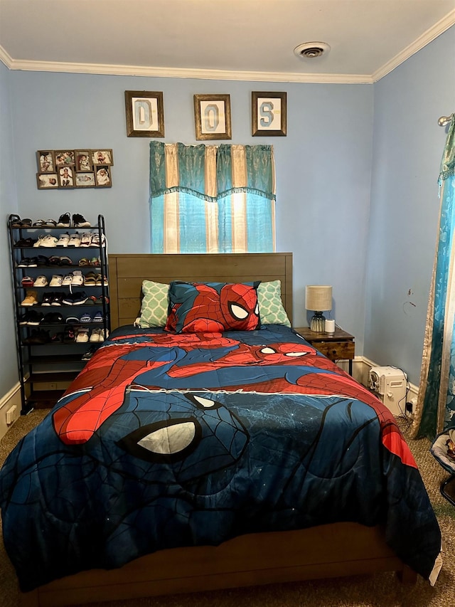 bedroom with crown molding and carpet floors