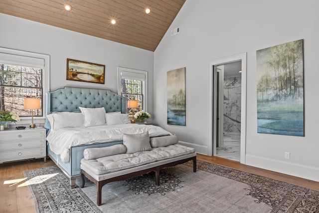 bedroom with visible vents, baseboards, recessed lighting, wood finished floors, and high vaulted ceiling