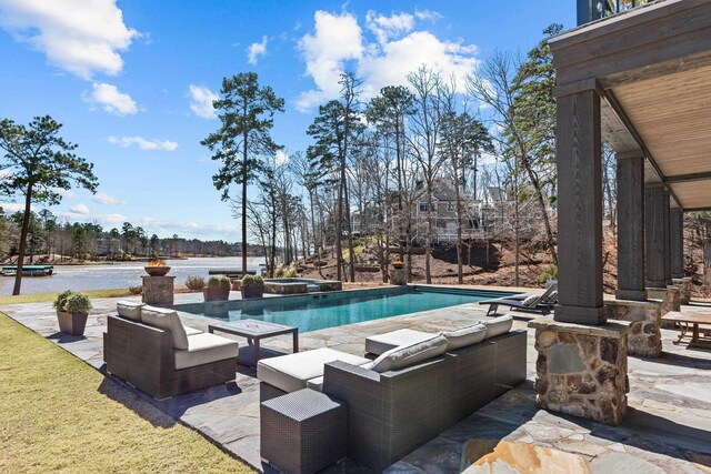 pool with a patio and an in ground hot tub