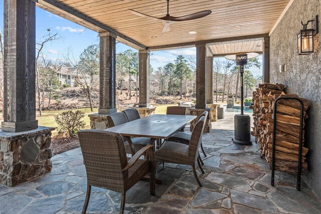 view of patio featuring outdoor dining space and a ceiling fan