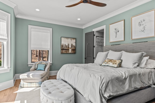 bedroom with recessed lighting, baseboards, wood finished floors, and crown molding