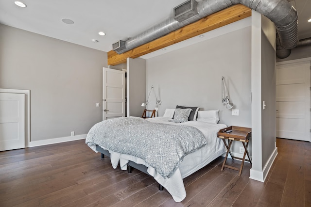 bedroom with dark wood-type flooring