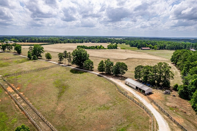 birds eye view of property with a rural view