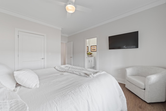 bedroom with ensuite bathroom, ceiling fan, dark wood-type flooring, baseboards, and crown molding