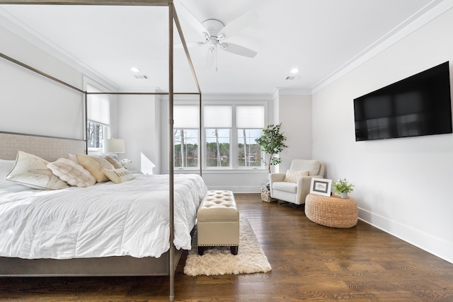 bedroom with dark wood-style flooring, a ceiling fan, visible vents, baseboards, and ornamental molding