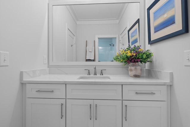 bathroom featuring a shower, ornamental molding, and vanity