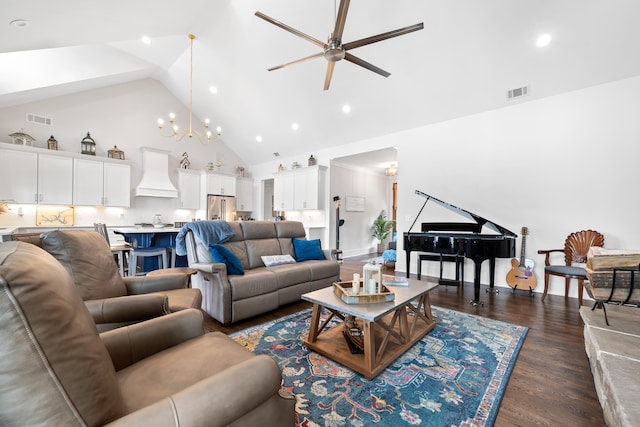 living area featuring dark wood-style floors, visible vents, high vaulted ceiling, and ceiling fan with notable chandelier