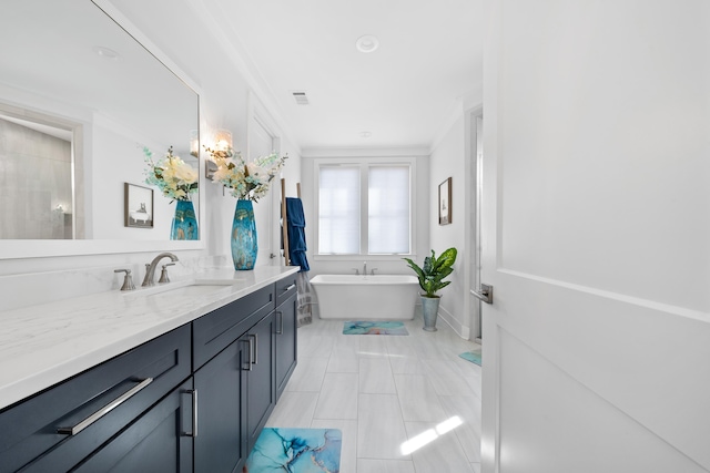 full bath with visible vents, a soaking tub, and vanity