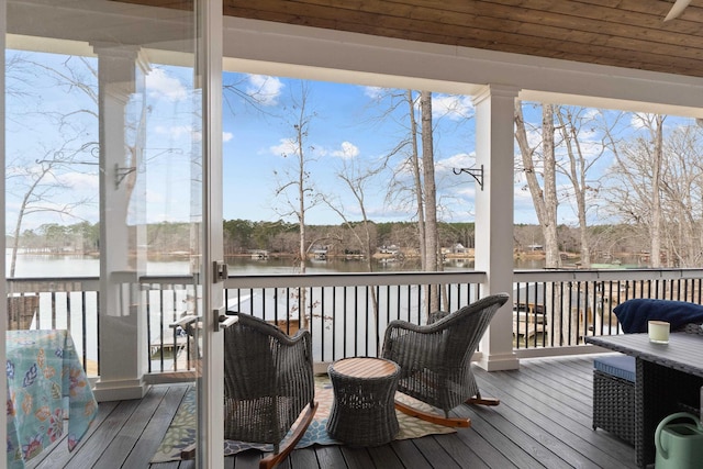 deck featuring a water view