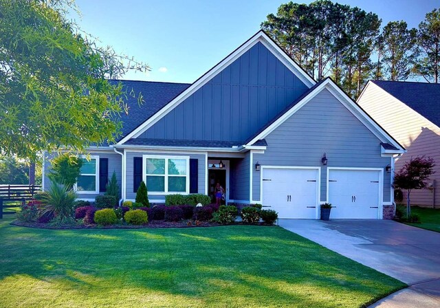 1041 Creekwood Cir, Madison, GA 30650 - view of front of property with board and batten siding, an attached garage, and driveway
