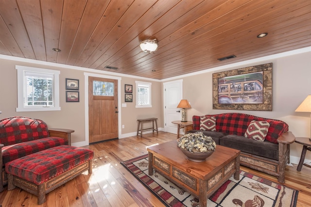 living area featuring wood ceiling, baseboards, visible vents, and light wood-style floors