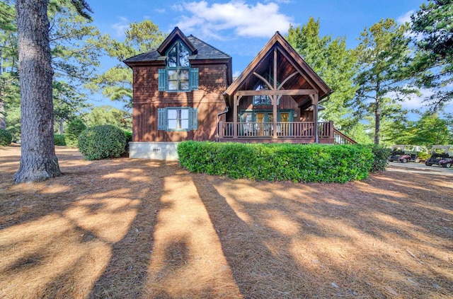 rustic home featuring crawl space and a shingled roof