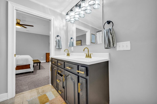 bathroom with ceiling fan, vanity, and tile patterned floors