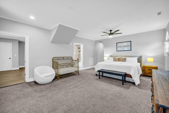 carpeted bedroom with ornamental molding and ceiling fan