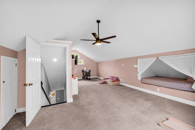 playroom with lofted ceiling, carpet floors, and ceiling fan