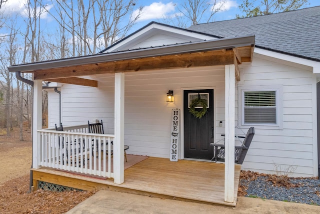 doorway to property with a porch