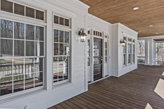 wooden terrace with a porch