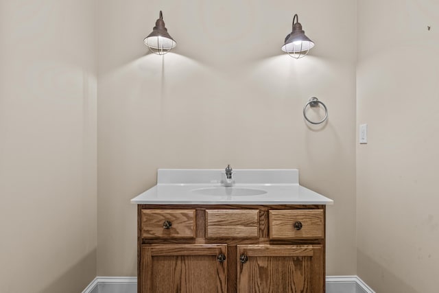 bathroom featuring baseboards and vanity