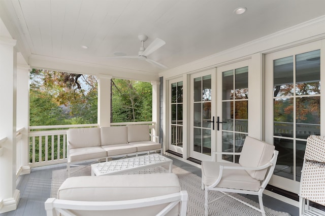 sunroom with wooden ceiling and ceiling fan