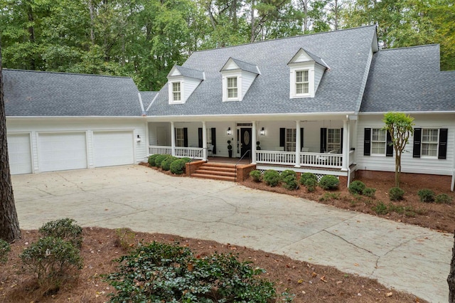 cape cod-style house with a porch and a garage