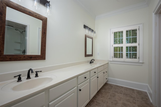 bathroom featuring crown molding, vanity, and tile patterned flooring