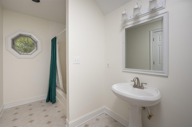 bathroom featuring shower / bath combination with curtain