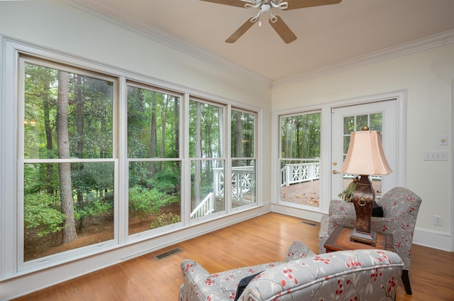 sunroom / solarium with ceiling fan