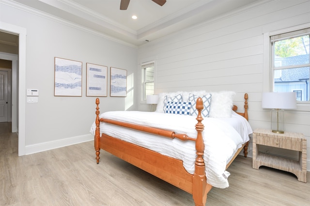 bedroom featuring crown molding, ceiling fan, and light wood-type flooring