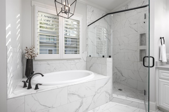 bathroom featuring ornamental molding and independent shower and bath