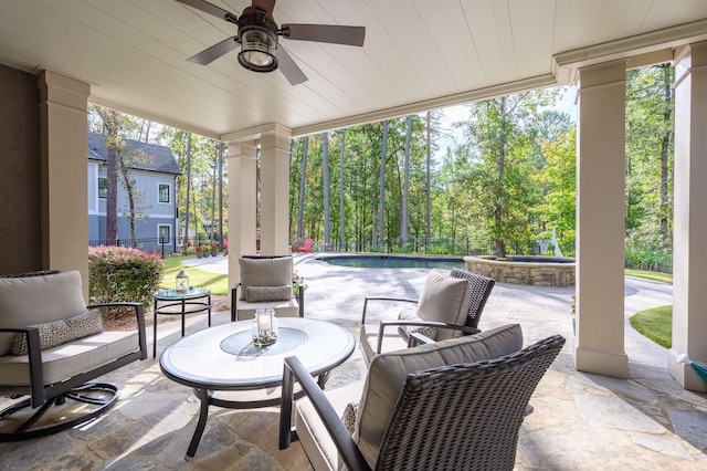 view of patio featuring ceiling fan