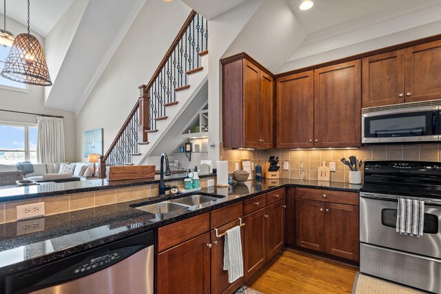 120UNIT304 Indian Summer Path, Eatonton, GA 31024 - kitchen with pendant lighting, sink, appliances with stainless steel finishes, light hardwood / wood-style floors, and dark stone counters