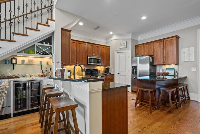 120UNIT304 Indian Summer Path, Eatonton, GA 31024 - kitchen with dark stone countertops, backsplash, wine cooler, a kitchen breakfast bar, and stainless steel appliances