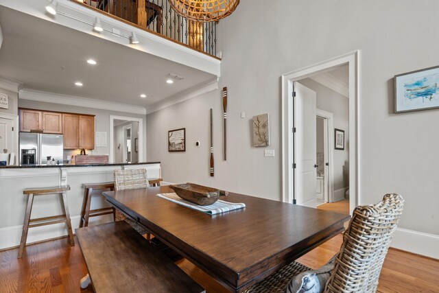 120UNIT304 Indian Summer Path, Eatonton, GA 31024 - dining area with crown molding and hardwood / wood-style floors