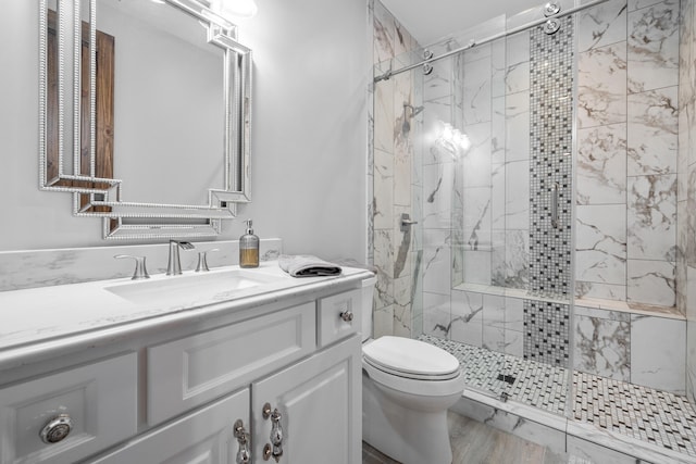 182 Corral Rd, Milledgeville, GA 31061 - full bathroom featuring a marble finish shower, toilet, and vanity