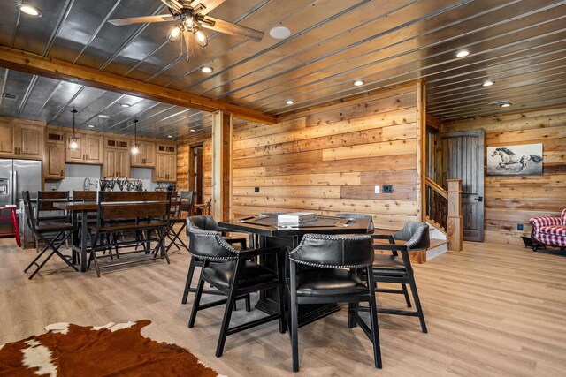 182 Corral Rd, Milledgeville, GA 31061 - dining room featuring ceiling fan, wooden walls, light wood-style flooring, wood ceiling, and stairs