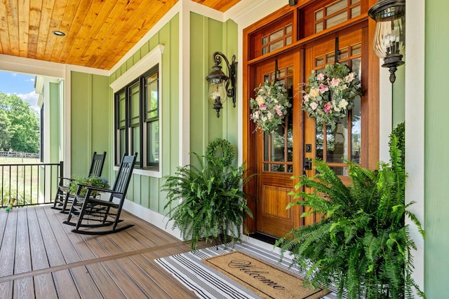 182 Corral Rd, Milledgeville, GA 31061 - view of exterior entry featuring covered porch and board and batten siding