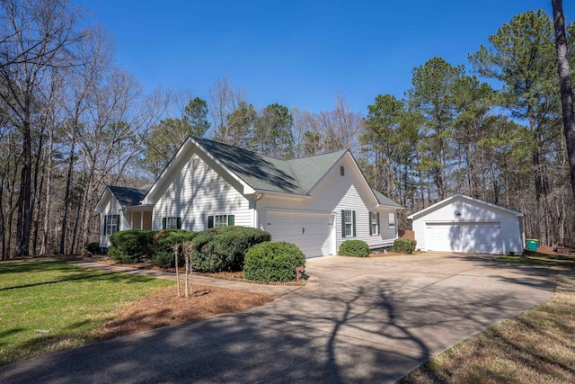 168 N Sugar Creek Rd, Buckhead, GA 30625 - view of side of property featuring an outbuilding, a lawn, a detached garage, and a shingled roof