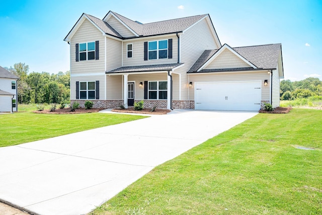 view of front of property featuring a garage and a front yard