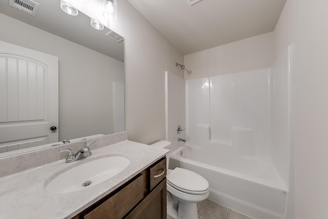 full bathroom featuring vanity, tile patterned floors, washtub / shower combination, and toilet