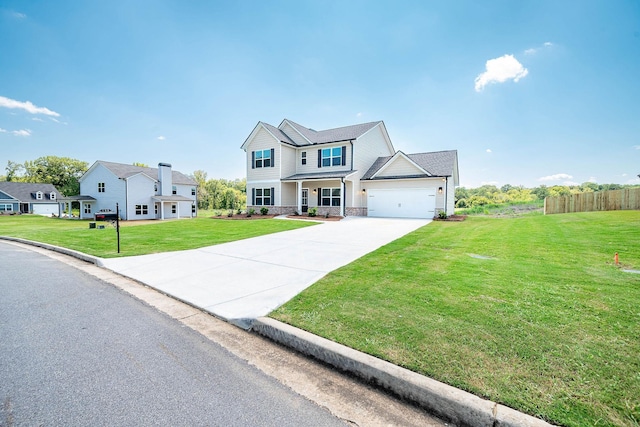 view of front of house with a garage and a front lawn