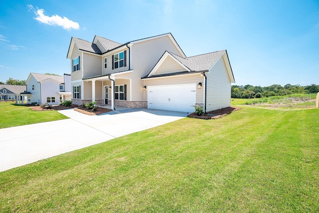 view of front of home with a garage and a front lawn