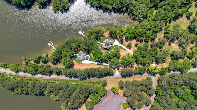 aerial view of property's location with a nearby body of water