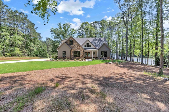craftsman inspired home with stone siding and a front yard