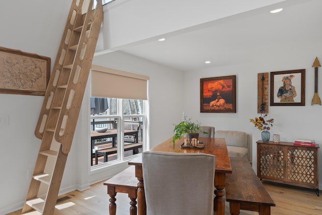 dining room featuring light wood-type flooring and recessed lighting